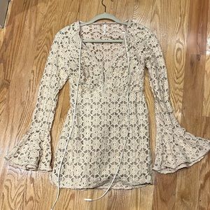 Sexy Free People long bell sleeve lace mini dress with side zip.